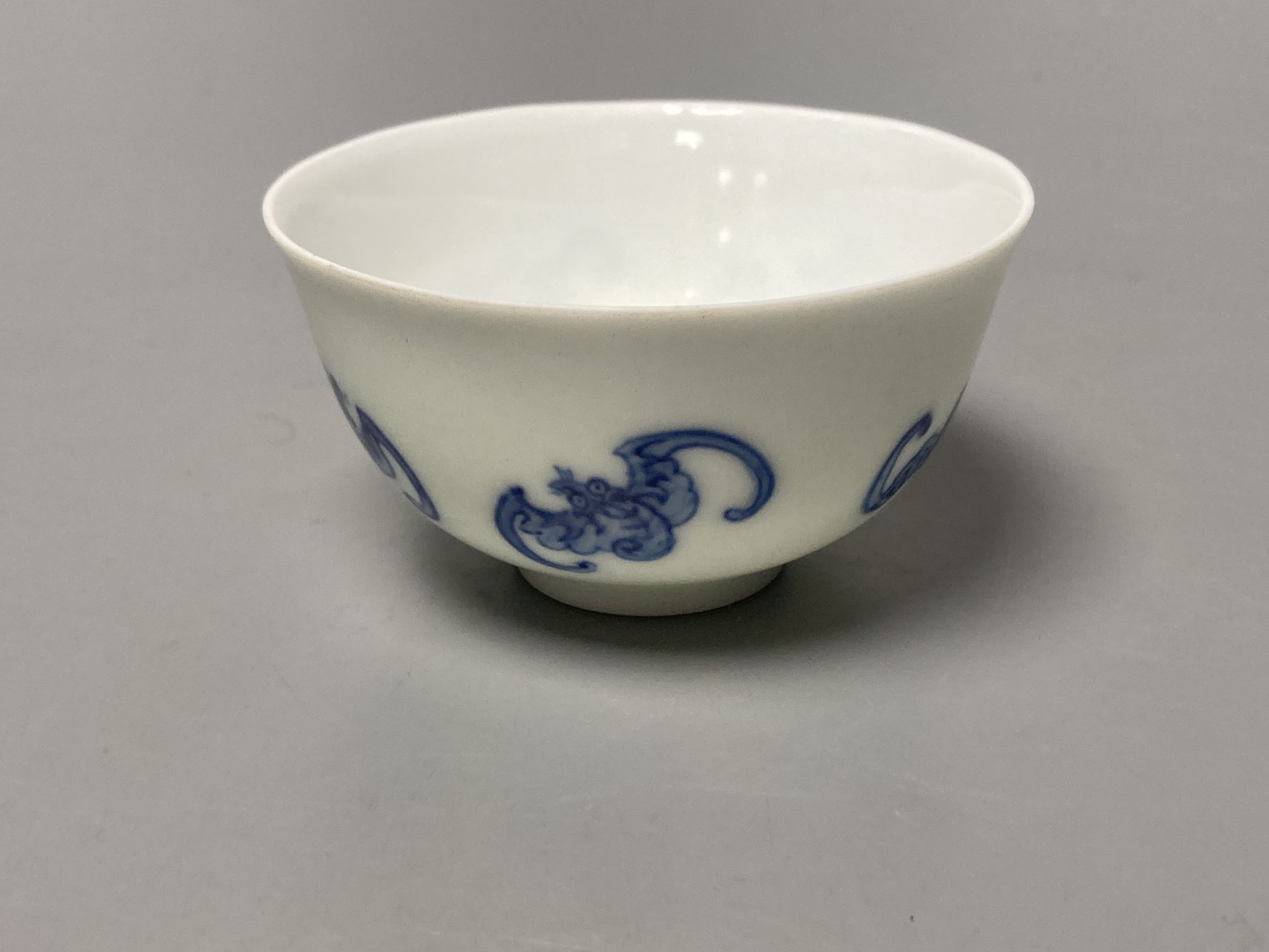 A Chinese blue and white 'five bat' tea cup, Kangxi mark but later, diameter 8cm